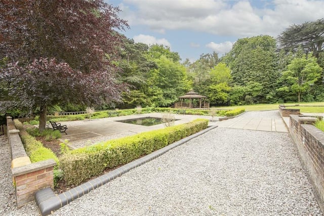 The landscaped gardens has a wild swimming pool and a wooden gazebo, as well as plenty of trees