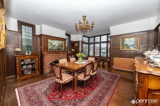 Featuring beautiful wood panelling, this dining room offers space to host events for family and friends