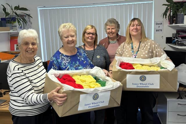 Dunstable Inner Wheel members deliver their gifts of hats.