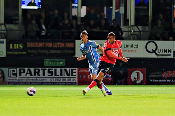 Carlton Morris slots home his second goal of the evening against Coventry on Wednesday night