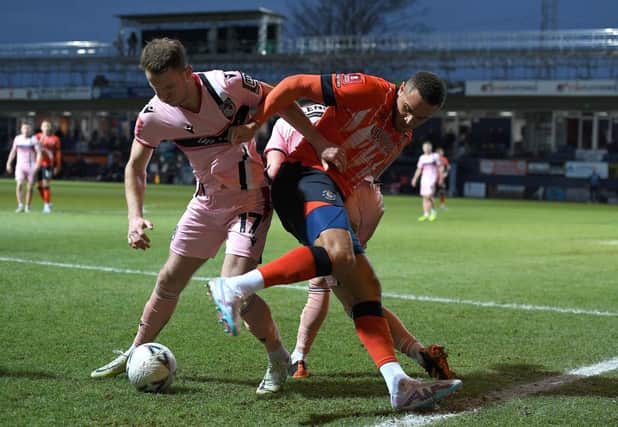 Carlton Morris is challenged during Luton's 2-2 draw with Grimsby on Saturday