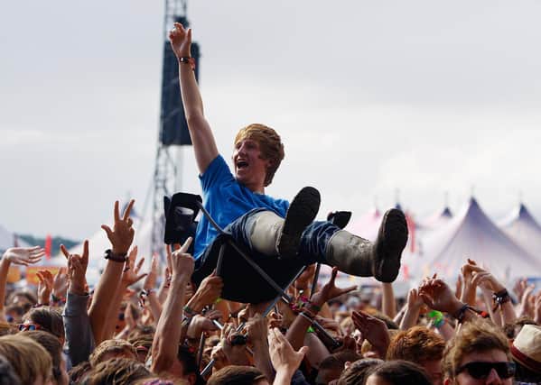 A music fan crowd surfs on a camping chair at Reading Festival (Photo by Simone Joyner/Getty Images)