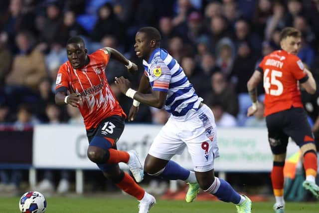 Hatters midfielder Marvelous Nakamba looks to make a challenge against Reading