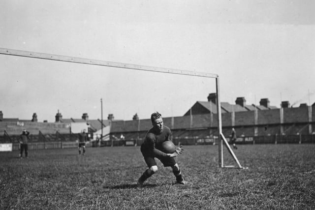 Luton Town goalkeeper H Bailey, makes a catch during a training session in 1922.  (Photo by Topical Press Agency/Getty Images):