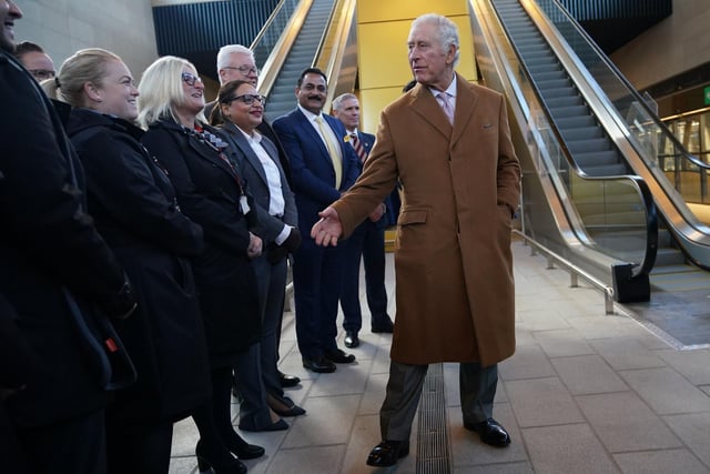 King Charles III meets easyJet staff during a visit to Luton Airport to learn about the new transit system which will connect Luton Airport Parkway rail station to London Luton Airport. PIC: Yui Mok/PA Wire