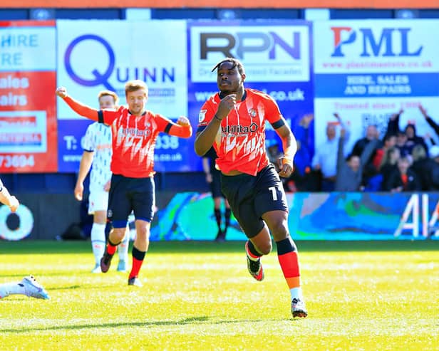 Pelly-Ruddock Mpanzu celebrates his second goal against Blackpool this afternoon