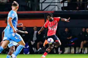 Town attacker Fred Onyedinma looks to get forward against Coventry