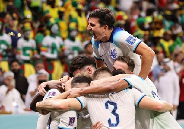 England celebrates their last 16 victory over Senegal on Sunday night