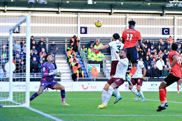 Elijah Adebayo heads Luton in front against Manchester City - pic: Liam Smith