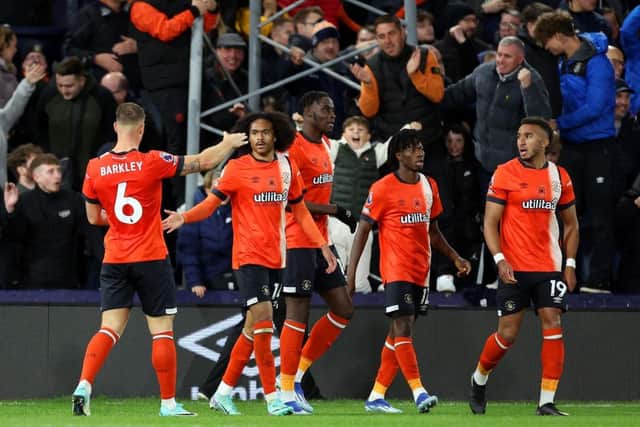 Tahith Chong of Luton Town celebrates with Ross Barkley after scoring his first ever Premier League goal against Liverpool - pic: Catherine Ivill/Getty Images