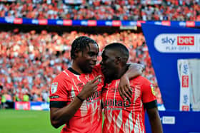 Town midfielder Pelly-Ruddock Mpanzu celebrates with Marvelous Nakamba at Wembley
