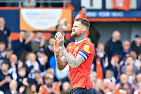 Sonny Bradley applauds the home faithful against Reading on Saturday