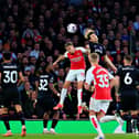 Daiki Hashioka heads clear against Arsenal - pic: Liam Smith