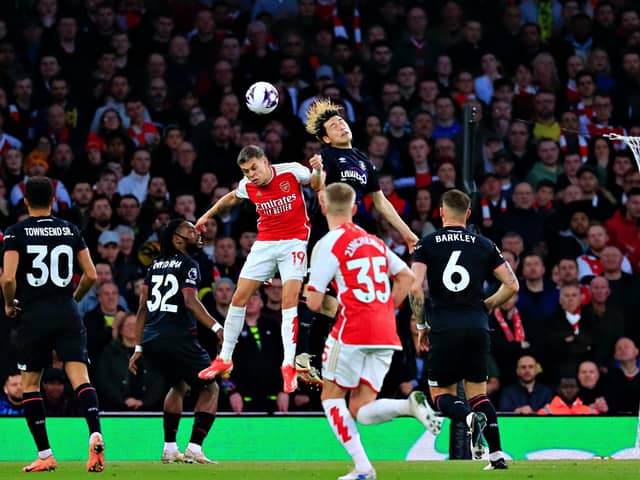 Daiki Hashioka heads clear against Arsenal - pic: Liam Smith