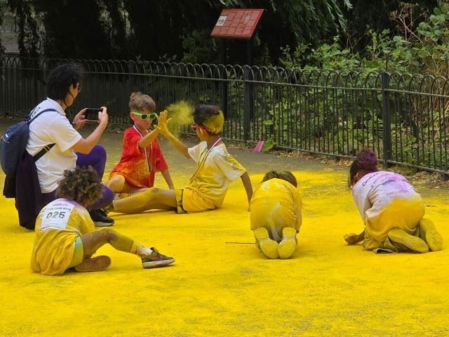 Children loved rolling around in a rainbow of powder!