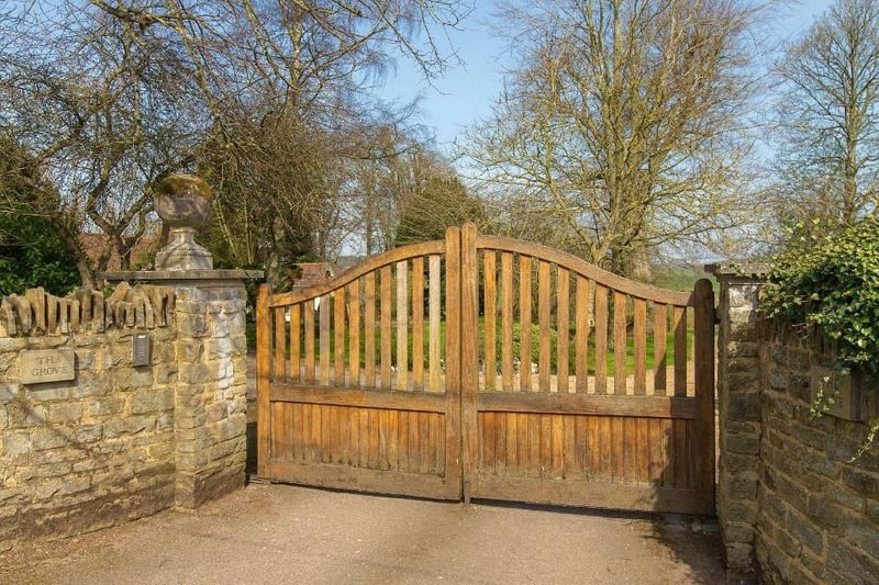 The property has automated front wooden gates