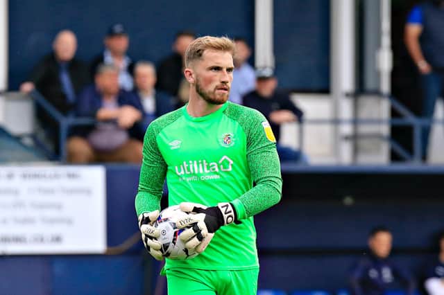 Town keeper Harry Isted made his full Football League debut for the Hatters against Cardiff