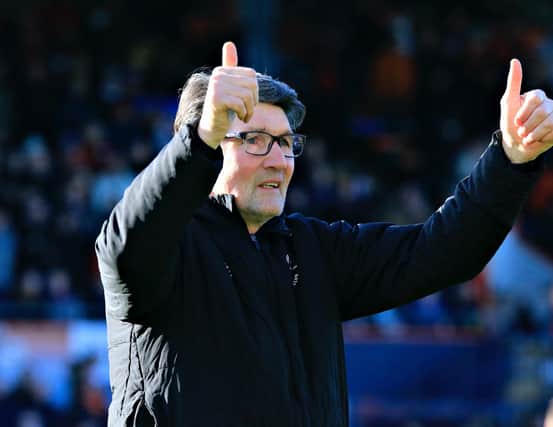 Mick Harford gives a thumbs up to the Luton crowd against Harrogate earlier this year
