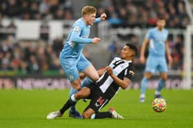 Isaac Hayden challenges Manchester City's Kevin De Bruyne during his time at Newcastle - pic: Stu Forster/Getty Images