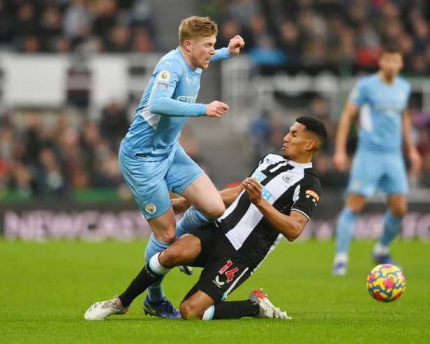 Isaac Hayden challenges Manchester City's Kevin De Bruyne during his time at Newcastle - pic: Stu Forster/Getty Images