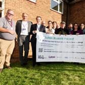 Luton MPs Sarah Owen and Rachel Hopkins with councillors Tom Shaw and Amy Nicholls, the vice chair of Luton Rising, with contractors who helped fit out the retrofit home. Picture: Luton Borough Council