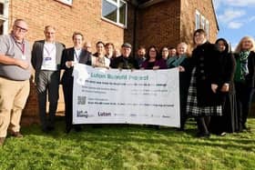 Luton MPs Sarah Owen and Rachel Hopkins with councillors Tom Shaw and Amy Nicholls, the vice chair of Luton Rising, with contractors who helped fit out the retrofit home. Picture: Luton Borough Council