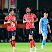 Town defenders Sonny Bradley and Dan Potts struggled to contain Coventry's forwards at Kenilworth Road last night