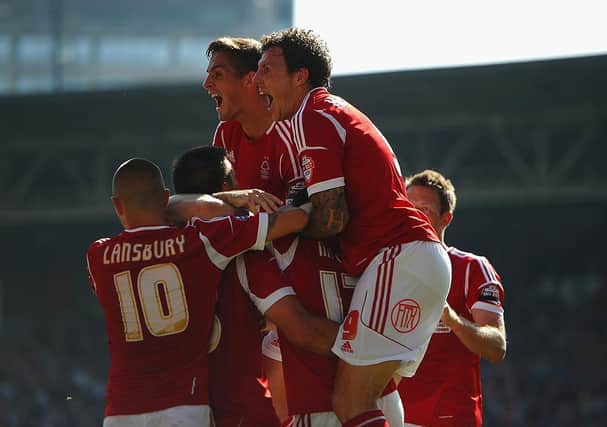 Chris Cohen and Henri Lansbury celebrate a goal during their time at Nottingham Forest in 2013