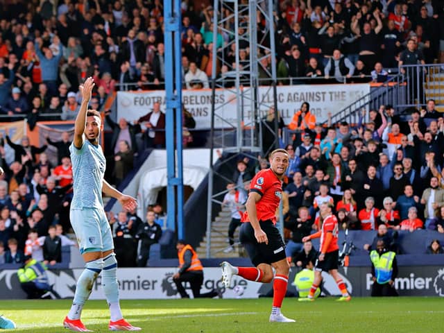 Luton striker Carlton Morris wheels away after scoring a last-minute winner for the Hatters on Saturday - pic: Liam Smith