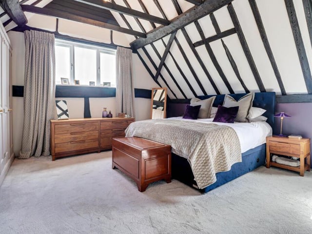 This is the largest of the house's four bedrooms -  ample space for family and guests to stay over.  This room was once the hay loft, but now has an amazing vaulted ceiling and extensive fitted wardrobes.