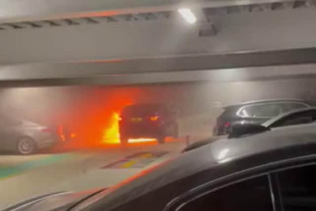 A vehicle in flames at London Luton Airport hours before a huge fire caused the multi-storey car park to partially collapse, Picture: SWNS
