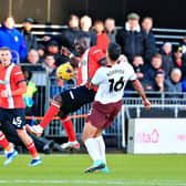 Marvelous Nakamba wins the ball ahead of Manchester City's Rodri on Sunday - pic: Liam Smith
