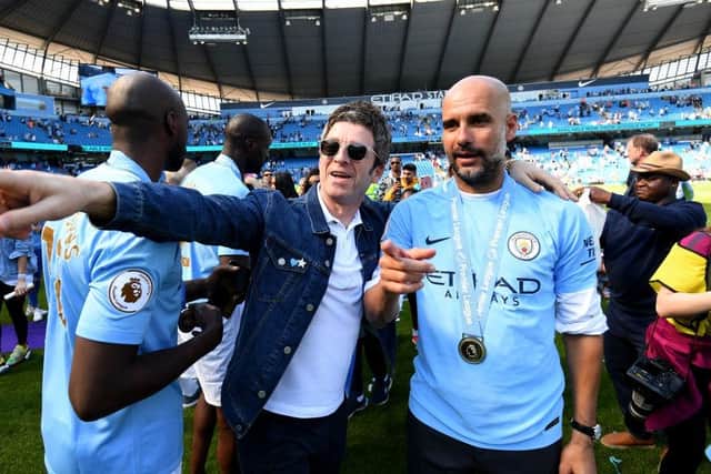 Former Oasis guitarist Noel Gallagher with Manchester City boss Pep Guardiola