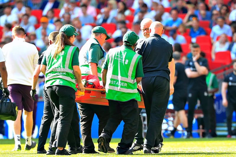 Tom Lockyer is stretchered off for the Hatters