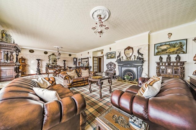 The property features five reception rooms, and a cosy sitting area