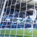 Devante Cole buries the loose ball into the net at Wycombe on Saturday - pic: David Horn / PRiME Media Images