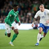 Chiedozie Ogbene tracks Greece defender Kostas Tsimikas during Ireland's 2-0 defeat in Dublin - pic: PAUL FAITH/AFP via Getty Images