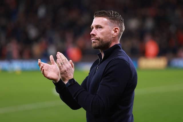 Luton boss Rob Edwards applauds both sets of fans at the Vitality Stadium on Saturday - pic: Warren Little/Getty Images