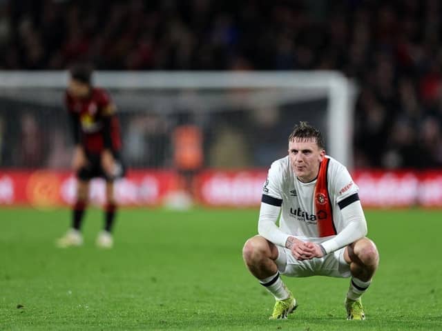 Luton defender Alfie Doughty slumps to his knees after Town were beaten 4-3 by AFC Bournemouth on Wednesday night - pic: ADRIAN DENNIS/AFP via Getty Images