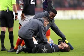 Tom Lockyer requires treatment during Luton's 3-1 defeat against Brentford on Saturday - pic: Warren Little/Getty Images