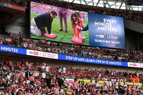 Tom Lockyer performs a CPR technique demonstration during the Championship play-off final match between Sheffield United and Sunderland at Wembley Stadium - pic: Mike Hewitt/Getty Images
