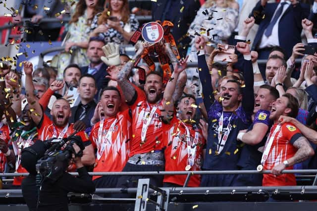 Luton lift the trophy after winning the play-off final against Coventry