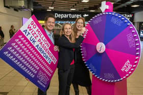 Wizz Air spin to win flight vouchers at London Luton Airport to celebrate Wizz Air reaching a 90 million passenger milestone. From left: Simon Harley, head of aviation at London Luton Airport, Marion Geoffrey, managing director of Wizz Air UK, and Eszter Rozsahegyi, head of Wizz Air ground operations. Picture: Matthew Power Photography