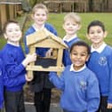 Pupils from Chalton Lower School with their brand new bird table. PIC: Matt Reading