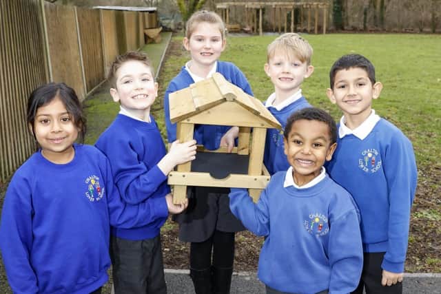 Pupils from Chalton Lower School with their brand new bird table. PIC: Matt Reading