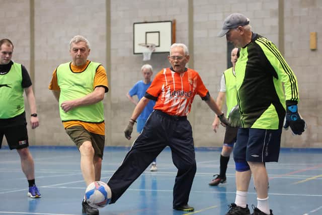 90-year-old Mike Fisher, nicknamed 'Ninja' in action playing walking football. Picture: Anita Maric / SWNS