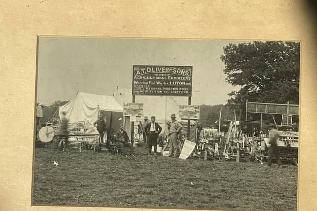 This old black and white picture captures one of the early show stands promoting A.T Oliver and Sons