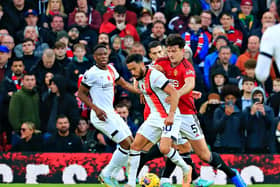 Andros Townsend shields the ball from Manchester United defender Harry Maguire - pic: Liam Smith