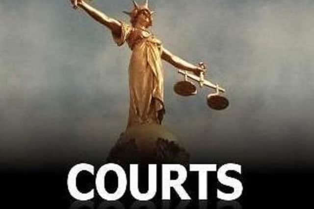 A Dunstable man won damages after being arrested, locked in a police cell overnight and taken to court in case of mistaken identity.