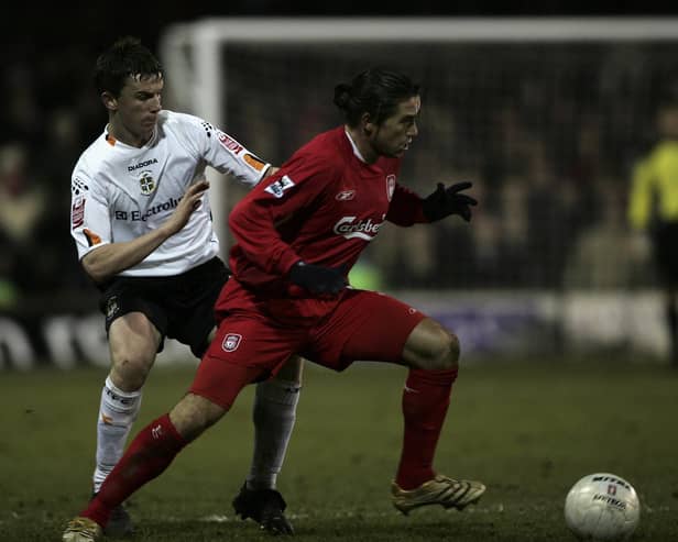 Kevin Foley tussles with Liverpool's Harry Kewell during his playing days at Kenilworth Road - pic: Tom Shaw/Getty Images